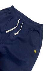 Sötétkék vintage melegítő nadrág hímzett sárga ló logóval, fehér zsinórral.
